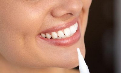 是牙齿松动是怎么引起的吗_抽烟留下的牙齿上的黑能不能洗掉