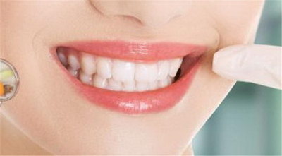 大牙有些松动怎么处理_大牙外侧牙龈上长了牙